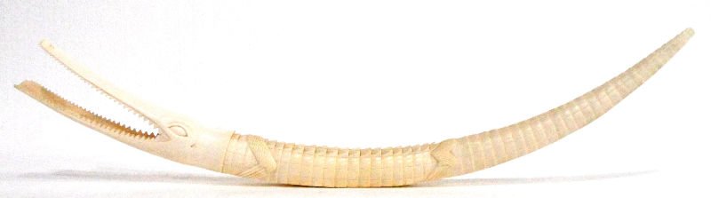 African Figural Carved Tusk: African figural carved tusk. Measuring 38 1/2" in length x 2 3/8" thick. For shipping and insurance quotes please call Ryan or Dave at Eagle Shipping Center 561-932-0700 or email them at ryan@eagleshi