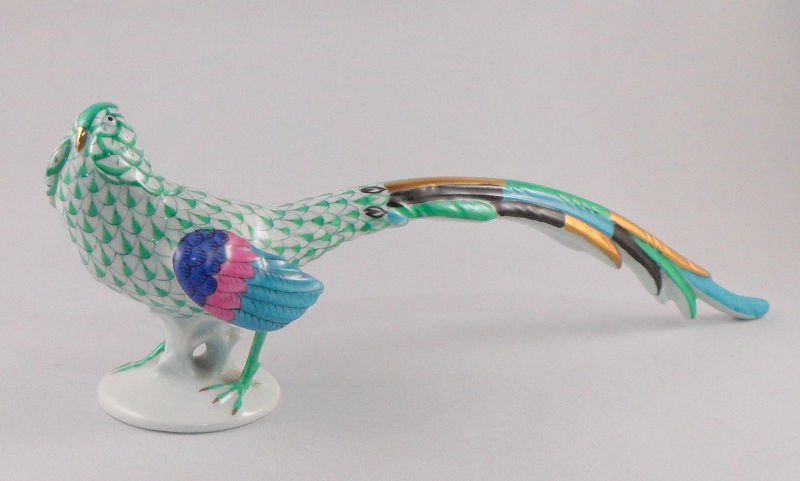 Vintage Herend Green Fishnet Pheasant Figurine: Vintage Herend Green Fishnet Pheasant Figurine with vintage Herend stamp located on bottom. This piece was made in Hungary. Measures 9'' long x 2 7/8'' high. For shipping and insurance quotes please c