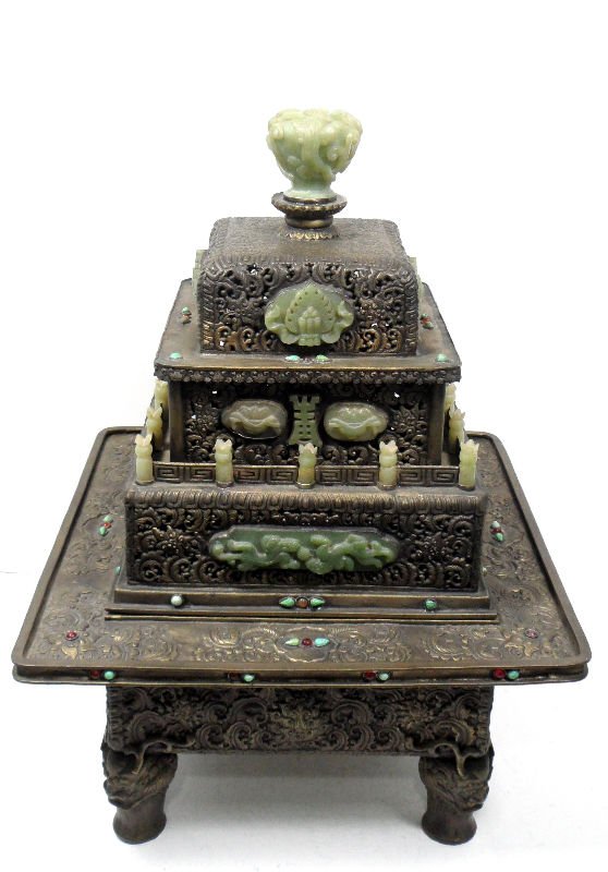Mongolian Silver & Jade Pagoda Box: Mongolian silver and jade pagoda box. This magnificent piece is crafted from highly detailed and pierced silver with jade accents. All of the jade is carved, and a large jade piece is placed as a fini