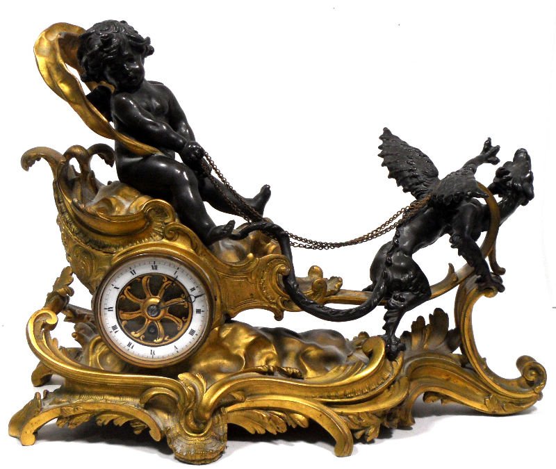 Dore Bronze Figural Mantle Clock: Dore Bronze Figural mantle clock of an angel ridig a chariot on an ornate dore bronze mantle clock. Measures 14 5/8" x 10 7/8".