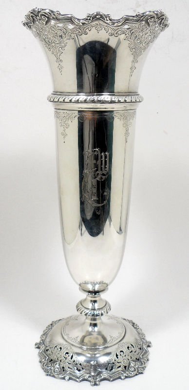 Watson Sterling Silver Pierced Vase: Watson sterling silver pierced footed vase scalloped ornate border and etched design. Has monogram, weighs 35 troy oz. Measures 16'' H x 6 3/8 D, bottom marks are as follows. No. A871 - Watson - Sterl