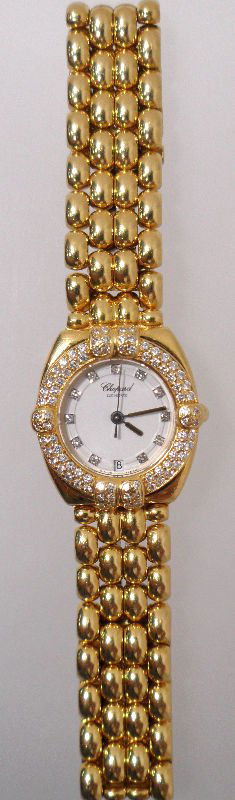 Chopard 18 kt YG Diamond Gstaad Ladies Watch: Magnificent Chopard 18kt yellow gold diamond bezel ladies Gstaad watch. 1.30 total carat weight. VS/EF color. Approx. Retail Price $22,000.00 Weight 59.0 dwt.