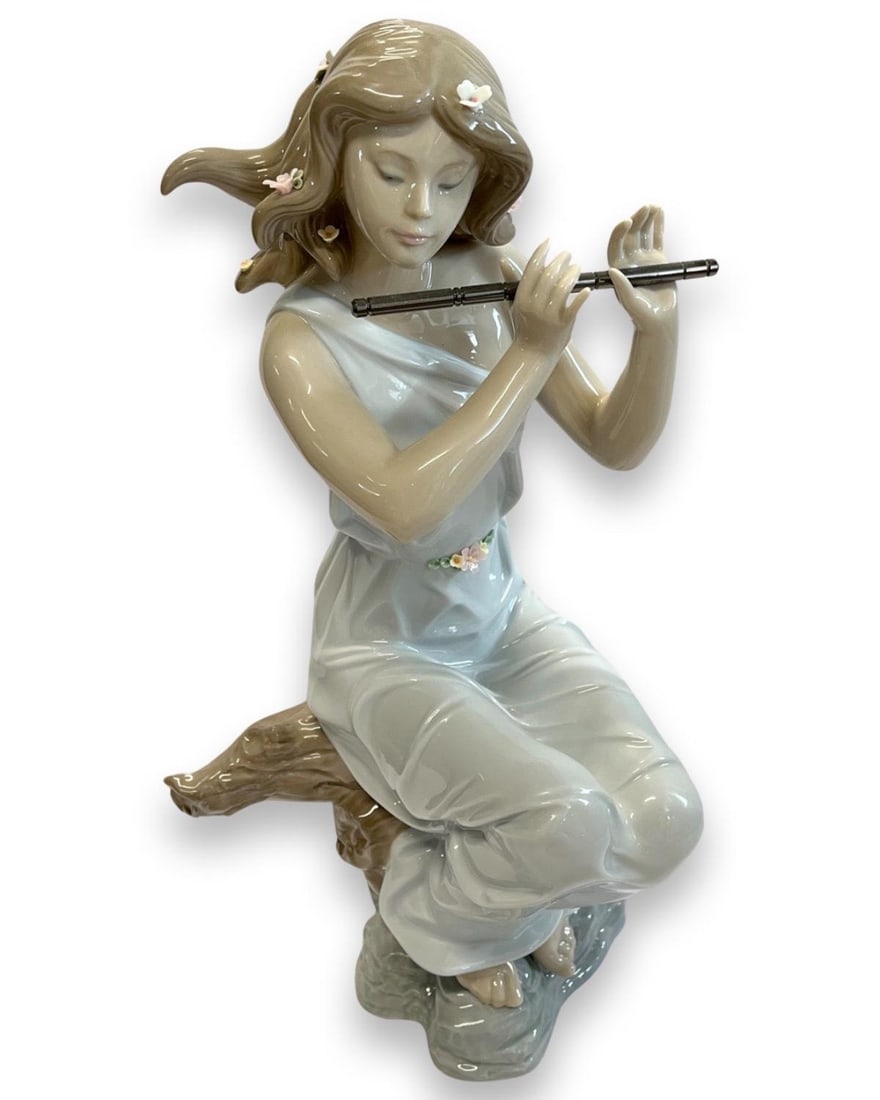 Lladro #6578 Girl with Flute Porcelain Figure: Lladro #6578 Girl with Flute Porcelain Figure measures H: 14"