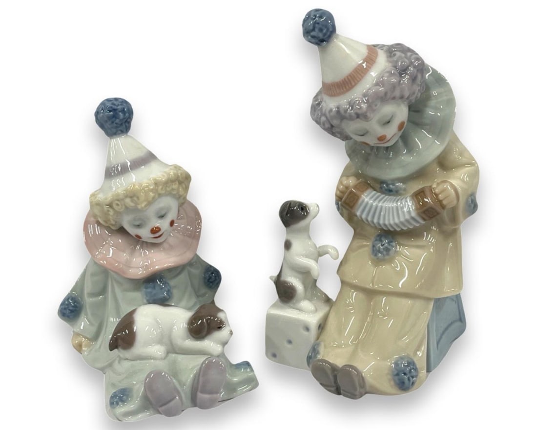 Pair of Lladro Porcelain Figurines: Pair of Lladro Porcelain Figurines includes #5279 Pierrot with Concertina & #5277 Pierrot with Puppy. Largest measures H: 6"