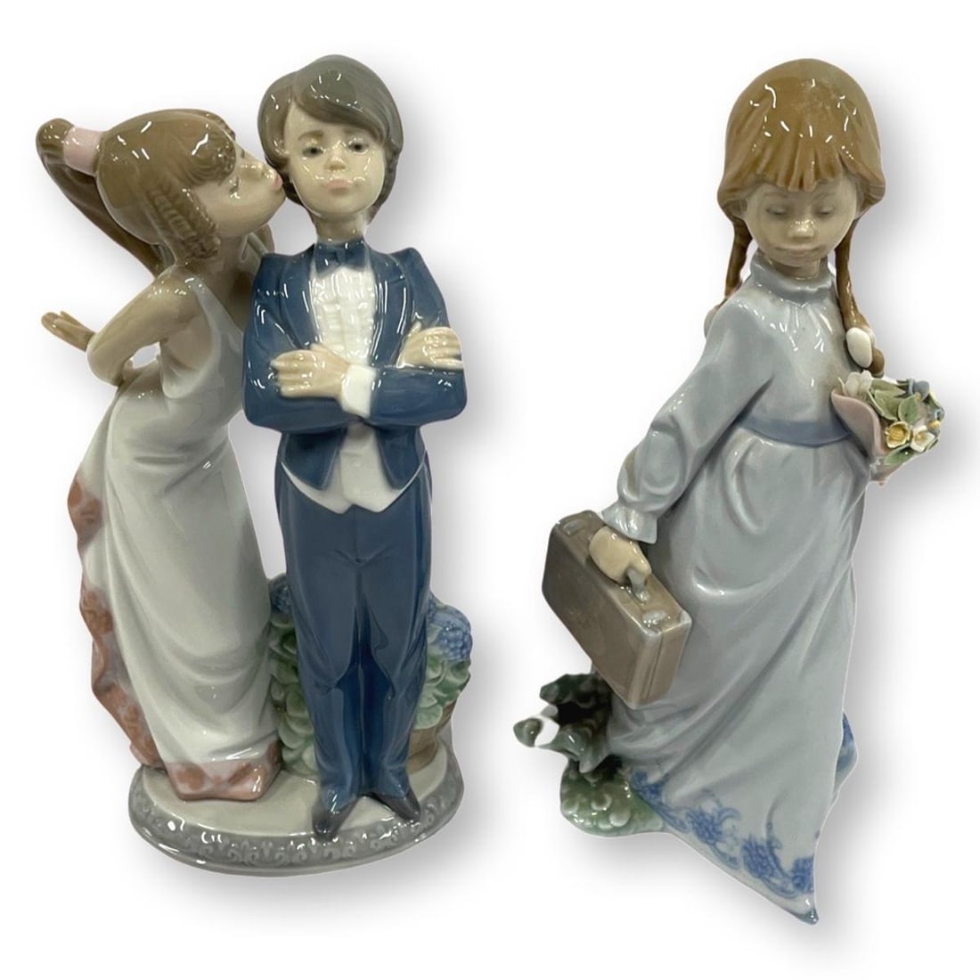 Pair of Lladro Porcelain Figurines: Pair of Lladro Porcelain Figurines includes #7604 School Days & #5555 Lets Make Up. Largest measures H: 8 1/4"