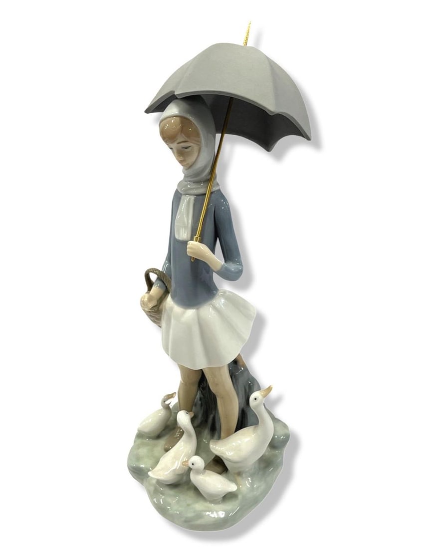 Lladro #4510 Girl with Umbrella & Geese Porcelain Figurines: Lladro #4510 Girl with Umbrella & Geese Porcelain Figurines measures H: 10 1/2"
