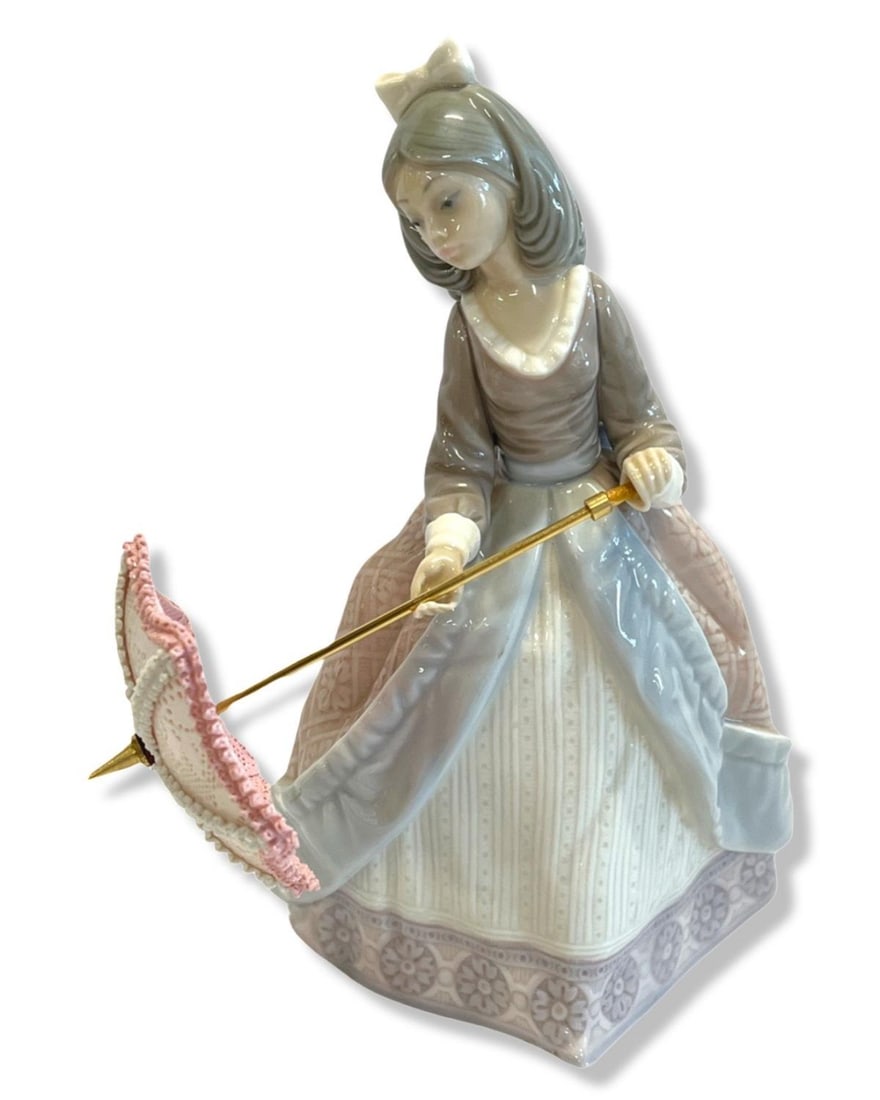 Lladro #5210 Jolie Girl with Parasol Porcelain Figurine: Lladro #5210 Jolie Girl with Parasol Porcelain Figurine measures H: 7 1/2"