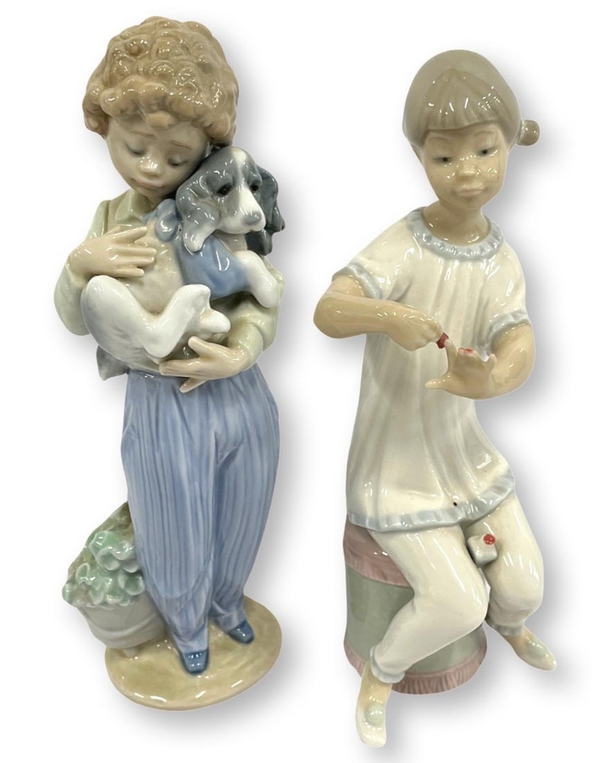 Pair of Lladro Porcelain Figurines: Pair of Lladro Porcelain Figurines includes #1082 Girl Manicuring & #7609 My Buddy. Largest measures H: 8 1/4". One has damage, sold as is