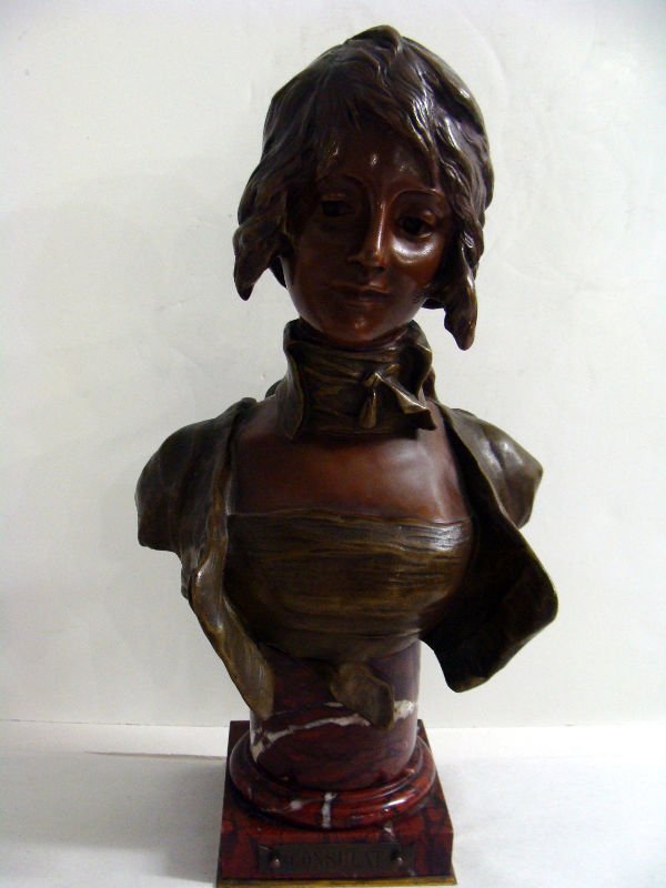 George van der Straeten Bronze Bust: Bust of a young woman bearing the signature of George van der Staeten (Belgian, 1856-1941). The young woman is places upon a red marble back. The sculpture exhibits a very fine patina. Foundry mark is