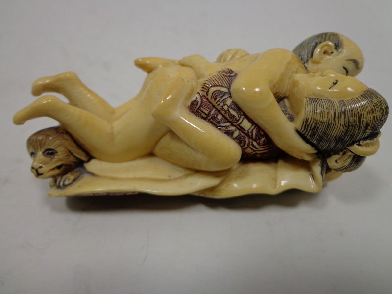 Japanese Ivory Erotic Netsuke: Japanese hand carved ivory two figure erotic netsuke measures 3"high x 1 1/2" wide.