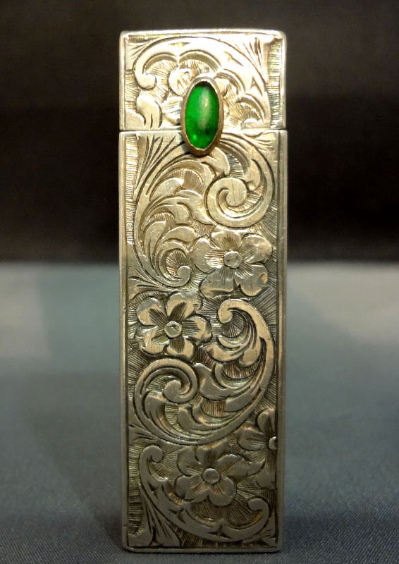 Antique 800 Silver Lipstick Case: Antique 800 silver lipstick case with beautiful filligre design and cabachon emerald closure. Weighs 1.52 toz. Measures 2 1/4" high x 3/4" wide x 3/4" depth. For Domestic or International Shipping Quo