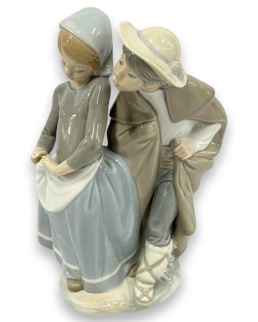 Lladro #1188 Boy Meets Girl Porcelain Figurines: Lladro #1188 Boy Meets Girl Porcelain Figurines measures H: 8 1/2"