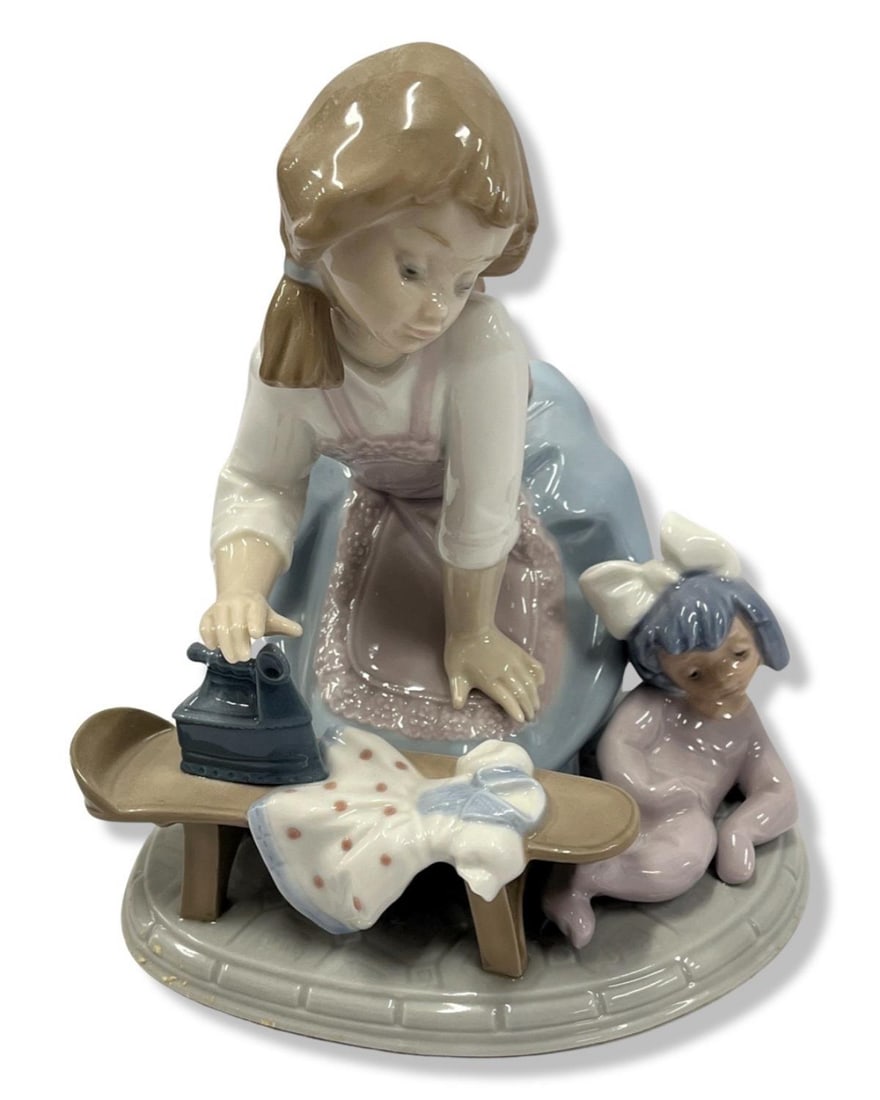 Lladro #5782 Girl Ironing Porcelain Figurines: Lladro #5782 Girl Ironing Porcelain Figurines measures H: 6 1/2"