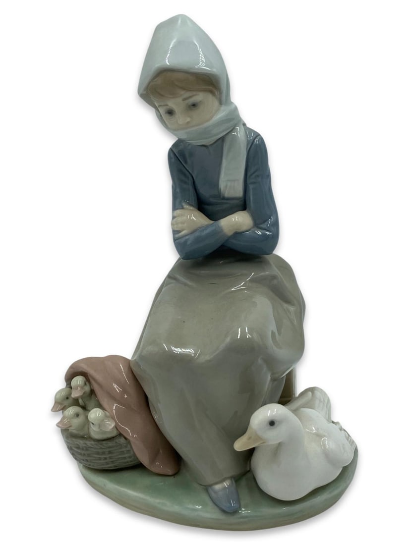 Lladro #1267 Duck Seller Porcelain Figurines: Lladro #1267 Duck Seller Porcelain Figurines measures H: 8 1/2"