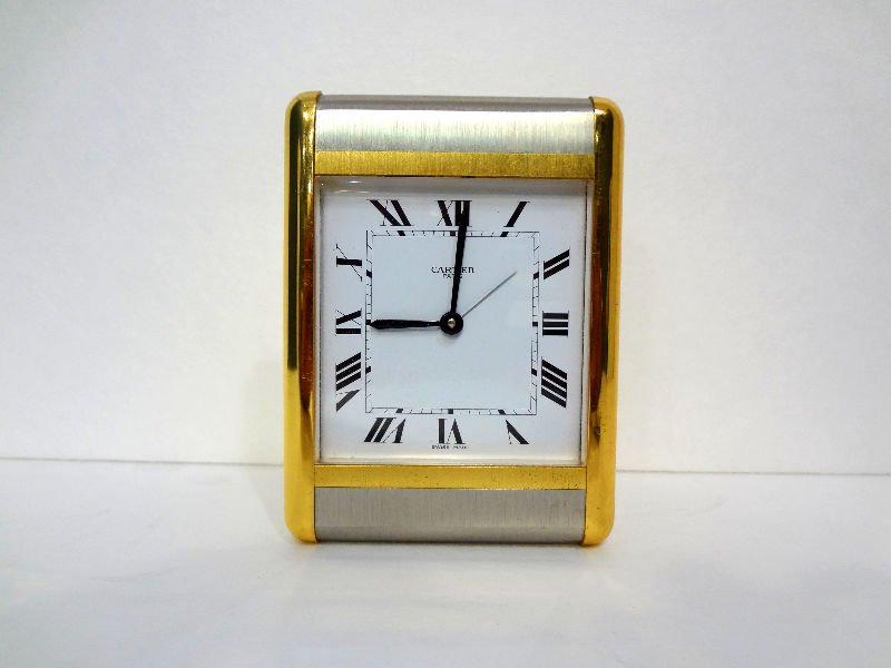 Cartier Two Tone Desk Clock: Cartier two tone desk clock back reads "Cartier Paris Quartz". Swiss made #7505-05578. Recetangular face-Cartier-Paris. Measures 3 3/4" high x 2 7/8" wide. For Domestic or International Shipping Quote