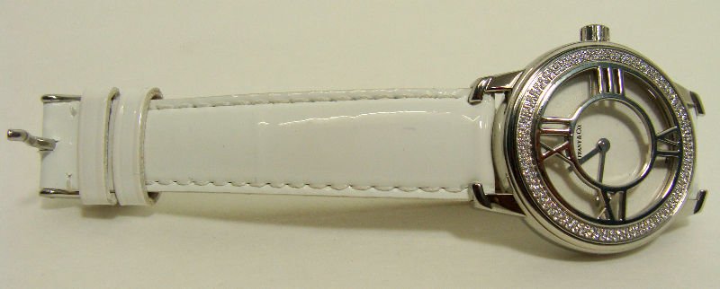 Ladies Tiffany Steel & Diamond Watch: Ladies Tiffany steel and diamond watch with white leather band. For Domestic or International Shipping Quotes Please Feel Call Ryan or Dave at Eagle Shipping Center 561-932-0700 or email them at ryan@