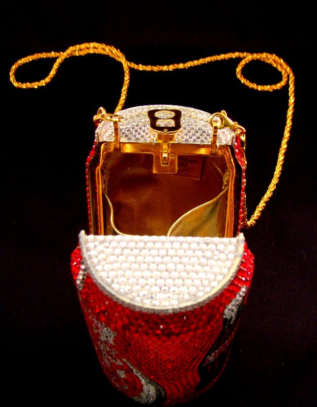 Kathrine Baumann Coca-Cola Purse: Kathrine Baumann Coca-Cola purse from the Brand Collection in original pouch. This purse is decorated with crystals and measures 5 1/8" high x 2 1/2" in diameter. For Domestic or International Shippin
