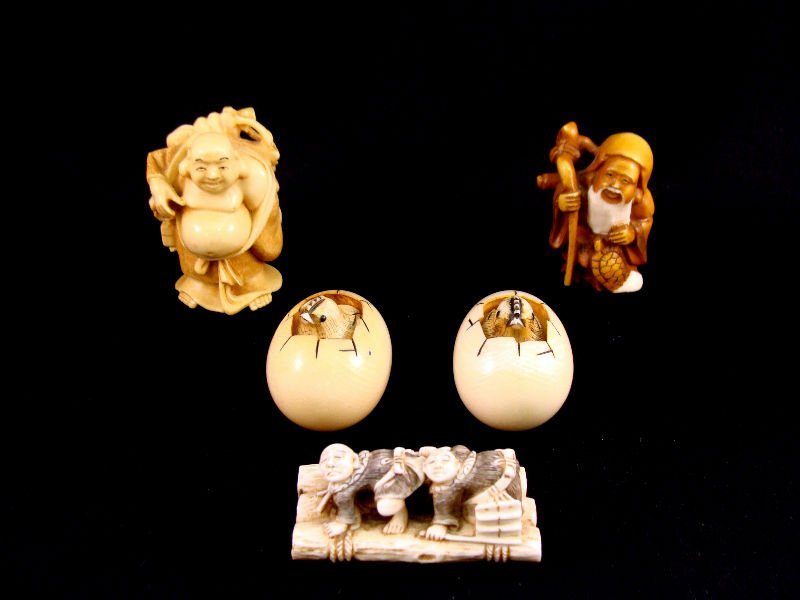 (5)Chinese Ivory Netsuke: (5) Chinese ivory Netsuke figures depicting 2 eggs with hatchlings, 2 figures on a raft, happy Buddha, and one tea stained polychrome elder with staff. Measurements range from 3/4"- 2" high. 1 1/8"-2"
