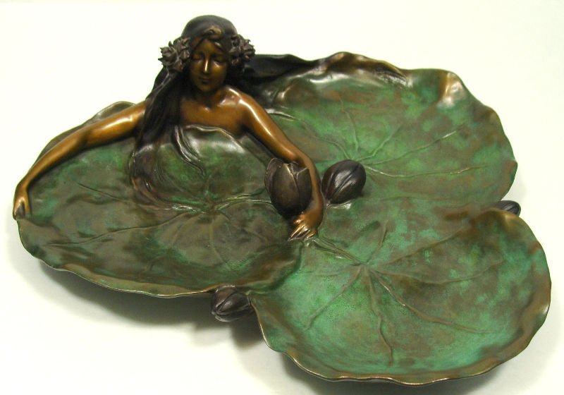 Raoul Larche (1860-1912) Bronze Centerpiece: Raoul Larche polychrome bronze figural leaf shape centerpiece. Measures 3 3/4 inches height x 13 3/4 inches x 11 3/4 inches. Signed on bottom #148. For Domestic or International Shipping Quotes Please