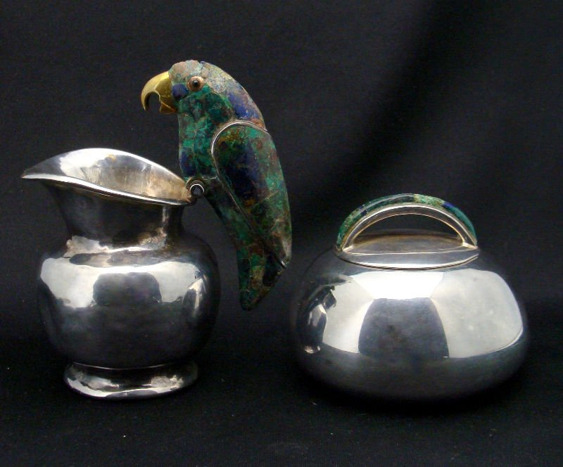 (2pc) Los Castillo Mixed Metal Creamer & Sugar: 2 piece Los Castillo mixed metal figural creamer and sugar. Marked "Los Castillos-Taxco". Creamer(dented) measures 2 7/8" high(not including figure). Figure measures 3 1/2" high. Covered sugar bowl me