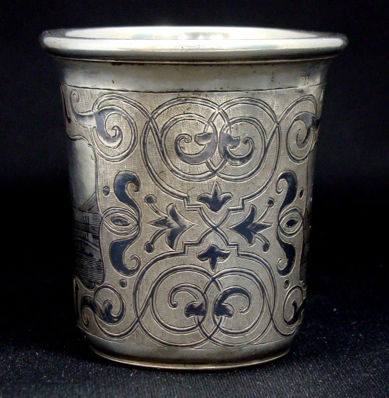 Antique 1858 Russian Silver Niello Vodka Cup: Russian silver vodka cup with Niello enamel decoration Moscow. Circa 1858. Hallmarks on bottom "1858-84-and the markings for assay master Andre Kolvasky. Measures 2 1/2" high x 2 1/2" diameter. For Do