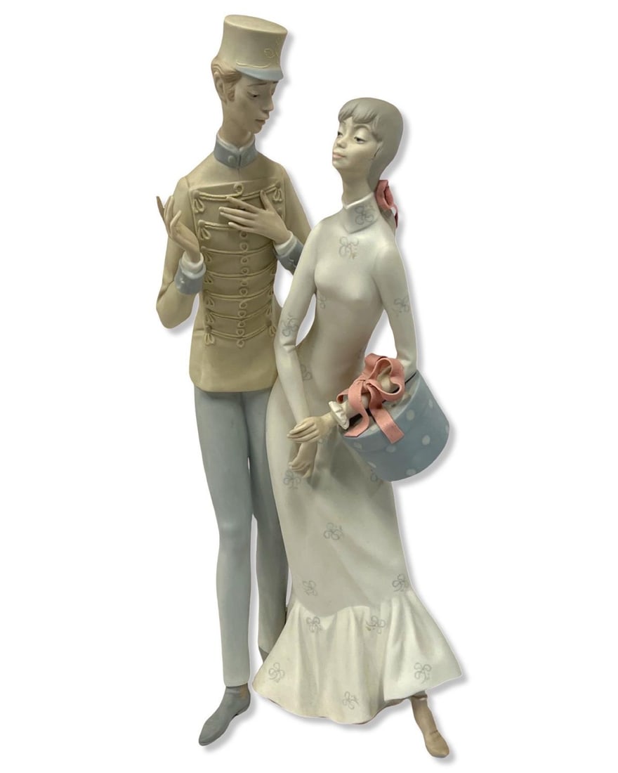 Lladro Porcelain Figurines a Man in Uniform Courting a Lady with a Gift: Lladro Porcelain Figurines a Man in Uniform Courting a Lady with a Gift measures H: 17"