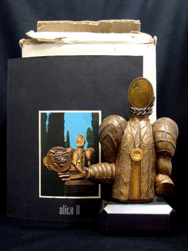 Miguel Berrocal(1933 Spanish) Sculpture: Miguel Berrocal(B.1933 Spanish) Alice II sculpture, nickel plated figural puzzle made in Italy with original book. Edition 251/500. Figure measures 5 1/4" high x 5 1/4" wide. Base measures 1 1/2" high