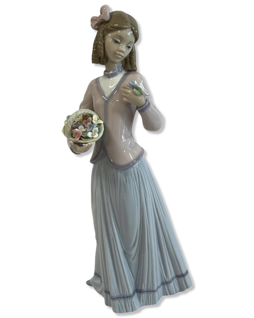 Lladro #7644 Innocence in Bloom Porcelain Figure: Lladro #7644 Innocence in Bloom Porcelain Figure measures H: 9 1/2"