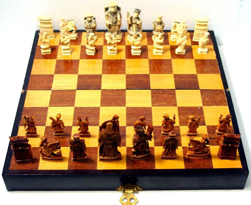 (32pc) Chinese Ivory Figural Chess Set: 32 piece Chinese ivory figural chess set with original game table/box. Pieces range from 2 1/4-4" tall. For Domestic or International Shipping Quotes Please Feel Call Ryan or Dave at Eagle Shipping Ce
