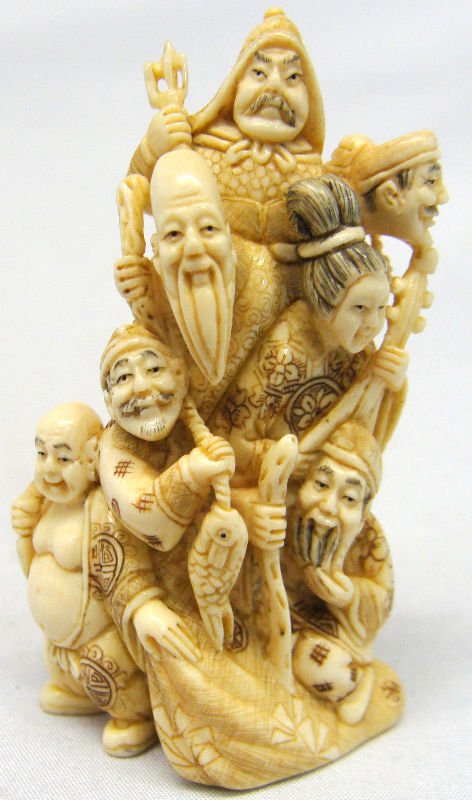 Exceptional Chinese Ivory Group: Exceptional highly important and rare Chinese ivory netsuke group depicting an emperor, empress, eldor, Buddha, and two other men that are carrying the king of the ocean on their shoulders with his lo