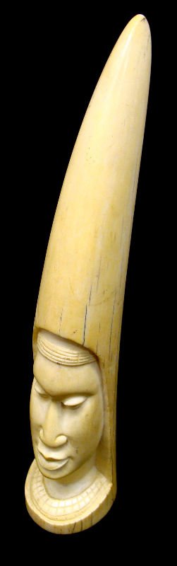 African Carved Ivory Figural Tusk: African carved ivory figural tusk. Measures 11 5/8" high. For Domestic or International Shipping Quotes Please Feel Call Ryan or Dave at Eagle Shipping Center 561-932-0700 or email them at ryan@eagles
