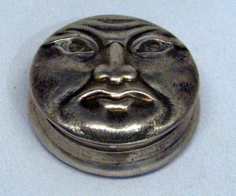 George W. Shiebler Sterling Silver Snuff Case: Sterling silver snuff case with a face on one side and a bat on the other side. Bold wash inside. Marked sterling silver on bottom side, under the cover. Measures 1 3/8" in diameter. Weighs 1ozt. For 