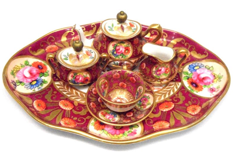 6pc Crown Staffordshire Mini Tea Set: 6 piece Crown Staffordshire mini porcelain tea set, comprising of a teapot 2". Creamer 1", covered sugar 1 1/2", teacup 7/8", tea saucer 2 1/8", and tray 5 5/8" x 7 5/8". For Domestic or International