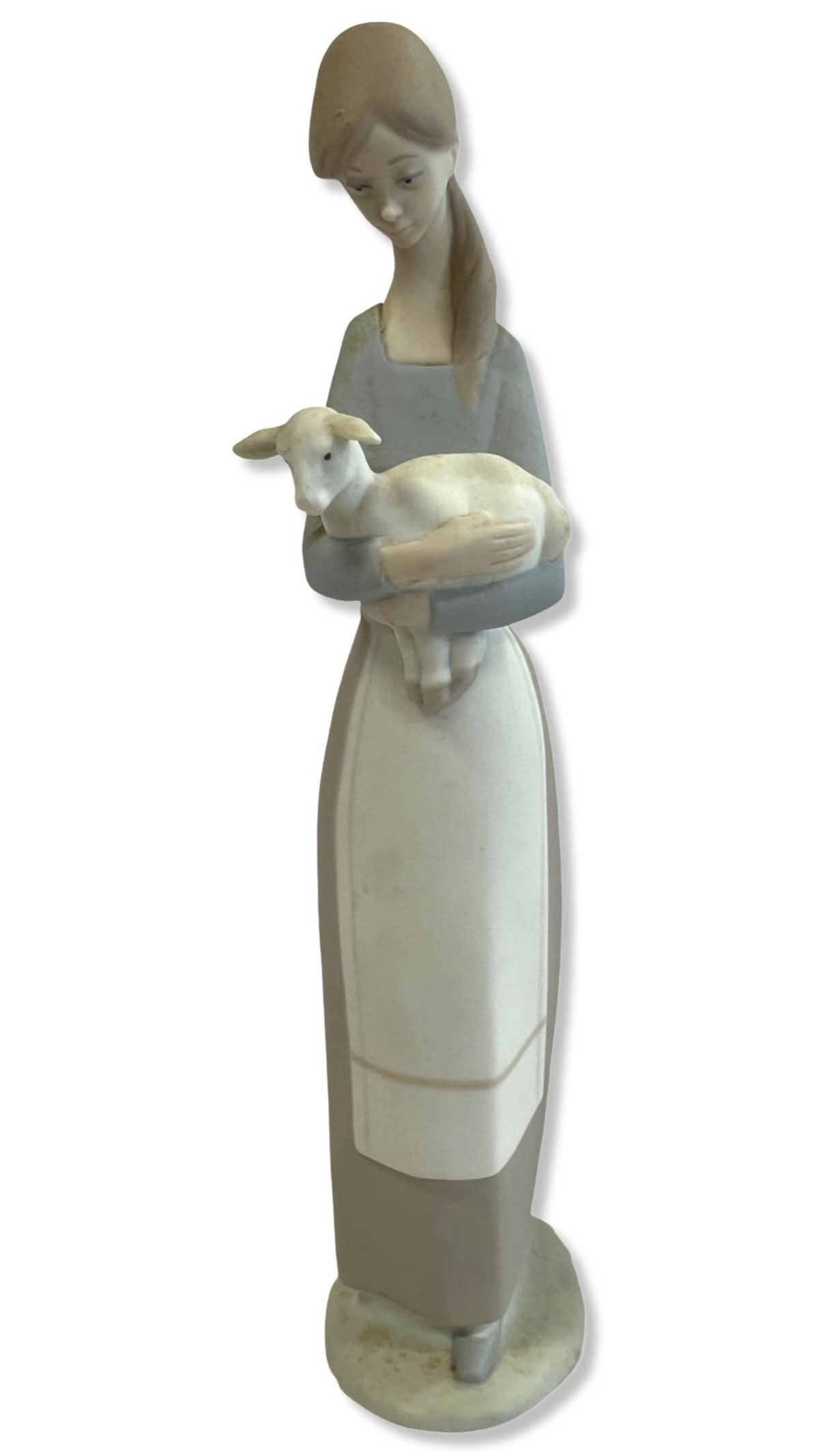 Lladro #4505 Girl with Lamb Porcelain Figurines: Lladro #4505 Girl with Lamb Porcelain Figurines measures H: 10 1/2"