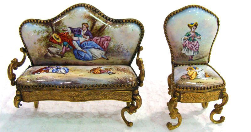 2pc French Enamel Miniature Salon Suite: 2 piece French enamel miniature salon suite comprising of a chair and sofa each has a romantic scene. The chair measures 2 1/2" tall x 1 1/4" wide x 1" depth. The sofa measures 2 1/2" tall x 2 3/4" wi