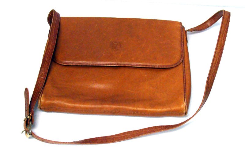 Vintage Fendi Crocodile Leather Tote Bag: Vintage Fendi Crocodile leather tote bag with crocodile inside and adjustable strap in caramel color. Height 10" . Wodtj 13". For Domestic or International Shipping Quotes Please Feel Call Ryan or Dav