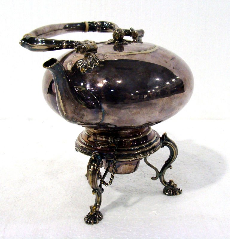 Antique English Silver Plated Tea Kettle On Stand: Antique english silver plated tea kettle with stand. Measures 15" high with handle. For Domestic or International Shipping Quotes Please Feel Call Ryan or Dave at Eagle Shipping Center 561-932-0700 or