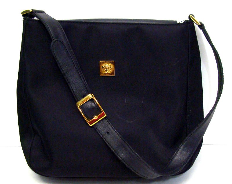 Giani Versace Ladies Black Hand Bag: Giani Versace ladies black hand bag. Measures 9" x 9" x 2 1/2" depth. For Domestic or International Shipping Quotes Please Feel Call Ryan or Dave at Eagle Shipping Center 561-932-0700 or email them at