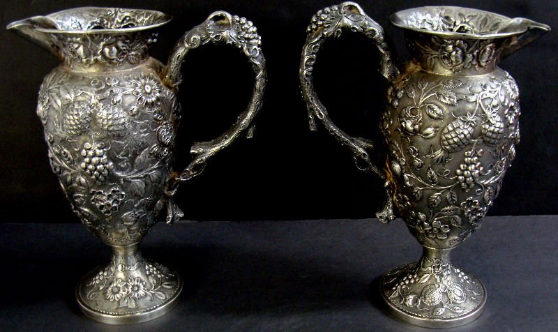 Pair Of Loring Andrews Sterling Pitchers: Pair of Loring Andrews Cincinati sterling silver pitchers featuring floral design, very ornate. Measures 8 3/4" high. 38toz. For Domestic or International Shipping Quotes Please Feel Call Ryan or Dave