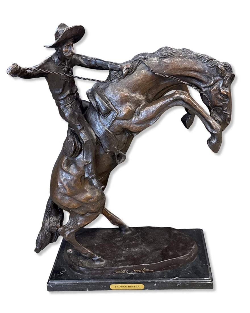 After Frederic Remington (American, 1861-1909) Bronze Sculpture on Marble Base Bronco Buster: After Frederic Remington (American, 1861-1909) Bronze Sculpture on Marble Base Bronco Buster measures H: 23 1/2" x W: 18" x L: 8"