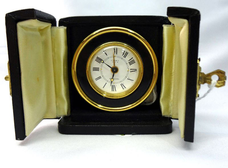 Tiffany & Co. 8 day 15 Jewel Desk Clock: Tiffany & Co. 8 day 15 Jewel Desk Clock, in brass with black enamel front with orignal case. Measures - 2 1/8" diameter. For Domestic or International Shipping Quotes Please Feel Call Ryan or Dave at