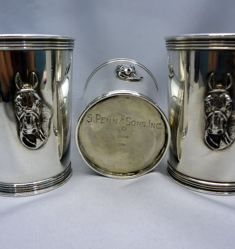 (3) Sterling Silver Kentucky Derby Julep Cups: (3) Sterling Silver Kentucky Derby Julep Cups, each featuring a raised horse head on the front. The cup measures 3 3/4" tall & 2 7/8" diameter. Bottom of each is engraved "S. Penn & Sons, Inc." Weighs