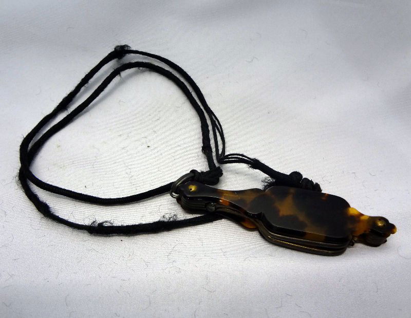 Vintage Tortoise Shell Folding Lorgnette/ Eye Glass: Vintage Tortoise Shell Folding Lorgnette/ Eye Glasses. The Lorgnette has a tiny lever which unfolds the spectacles. Spectacles extend 4". Case measures 2 7/8".For Domestic or International Shipping Qu