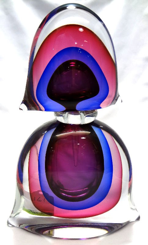 Luigi Onesto Murano Glass Decanter: Luigi Onesto Murano Glass Decanter, purple color, artist signed. Measures 11 1/2" high x 8" wide.For Domestic or International Shipping Quotes Please Feel Call Ryan or Dave at Eagle Shipping Center 56