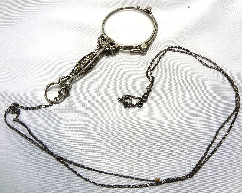 Sterling Silver Marcasite Lorgnette On Chain: Exceptionally decorated sterling silver marcasite lorgnette on chain on all sides. Can be used open or closed as a magnifier. Measures 4" in length.For Domestic or International Shipping Quotes Please