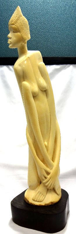 African Carved Ivory Figural Tusk: African Carved Ivory Figural Tusk on wooden base. Measures 16 3/4" high.For Domestic or International Shipping Quotes Please Feel Call Ryan or Dave at Eagle Shipping Center 561-932-0700 or email them 