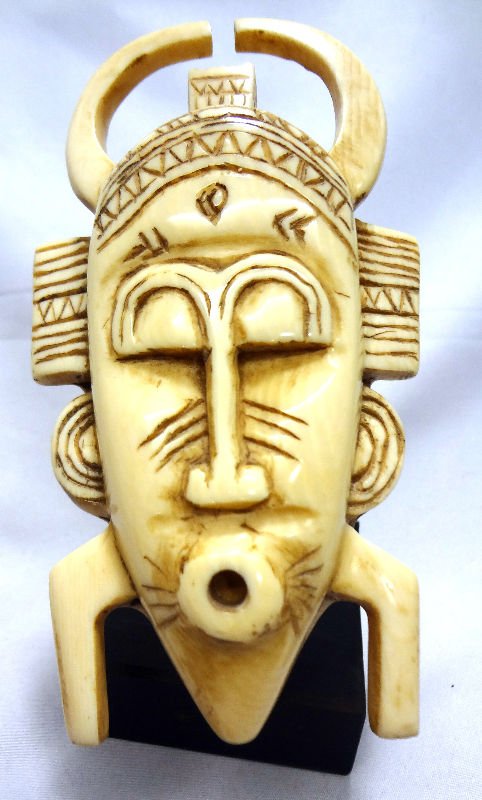 Carved African Ivory Mask: Carved African Ivory Mask. Measures 4 1/4" high.For Domestic or International Shipping Quotes Please Feel Call Ryan or Dave at Eagle Shipping Center 561-932-0700 or email them at ryan@eagleshippingcen