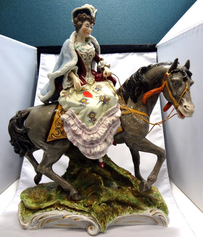 Capodimonte Porcelain "Lady Riding Side Saddle": Capodimonte Porcelain "Lady Riding Side Saddle". Lade on horse riding side saddle.For Domestic or International Shipping Quotes Please Feel Call Ryan or Dave at Eagle Shipping Center 561-932-0700 or e