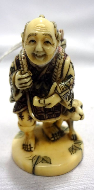Chinese Carved Ivory Netsuke: Chinese Carved Ivory Netsuke. Man with basket over shoulder and walking a dog. Measures 2" high.For Domestic or International Shipping Quotes Please Feel Call Ryan or Dave at Eagle Shipping Center 561