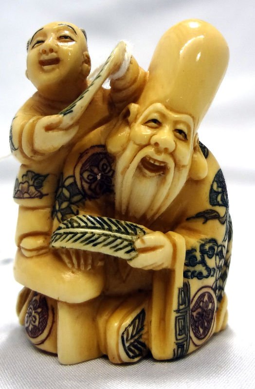 Chinese Ivory Netsuke - 2 Figure Group: Chinese Ivory Netsuke - 2 Figure Group. Elder with child. Measures 2" high.For Domestic or International Shipping Quotes Please Feel Call Ryan or Dave at Eagle Shipping Center 561-932-0700 or email th